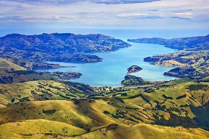Explore the stunning contours of the Banks Peninsula where lush hills embrace the twin harbours revealing extraordinary views and a chance to encounter rare marine life in Akaroa.